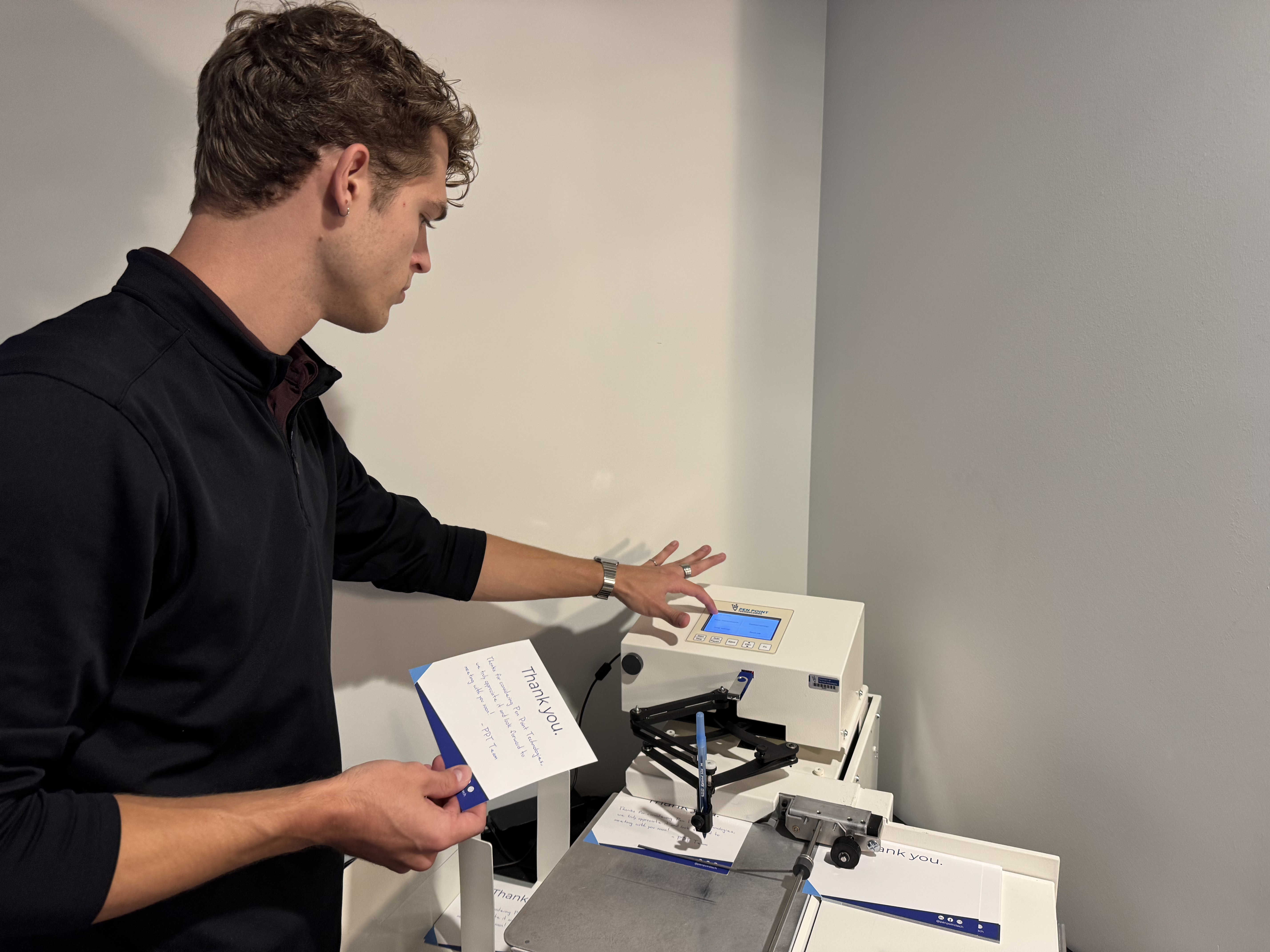 A Pen Point technician working hands-on to diagnose and solve a UniProd machine issue