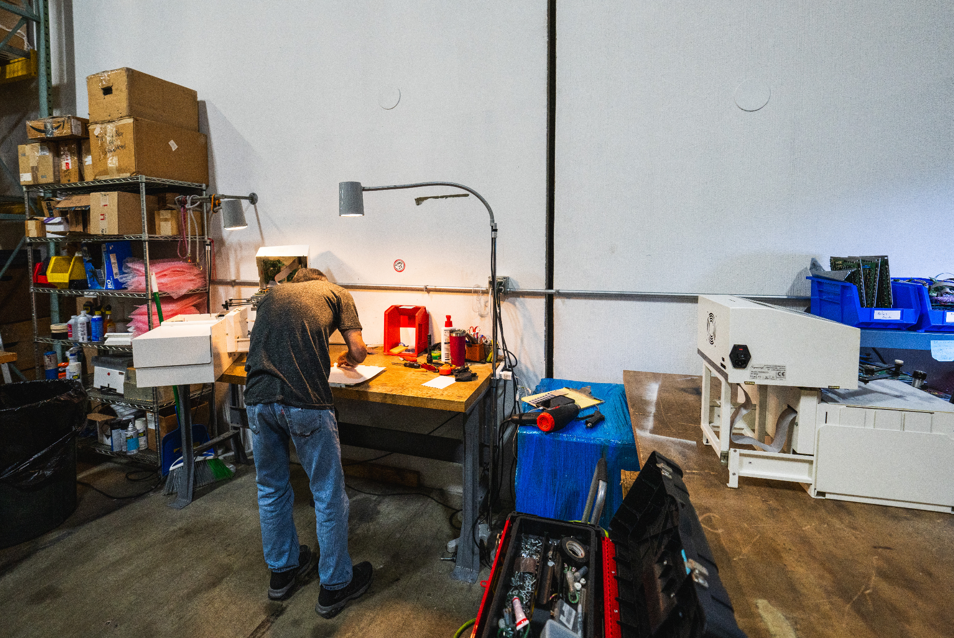 Technician servicing a machine at the Louisville repair station