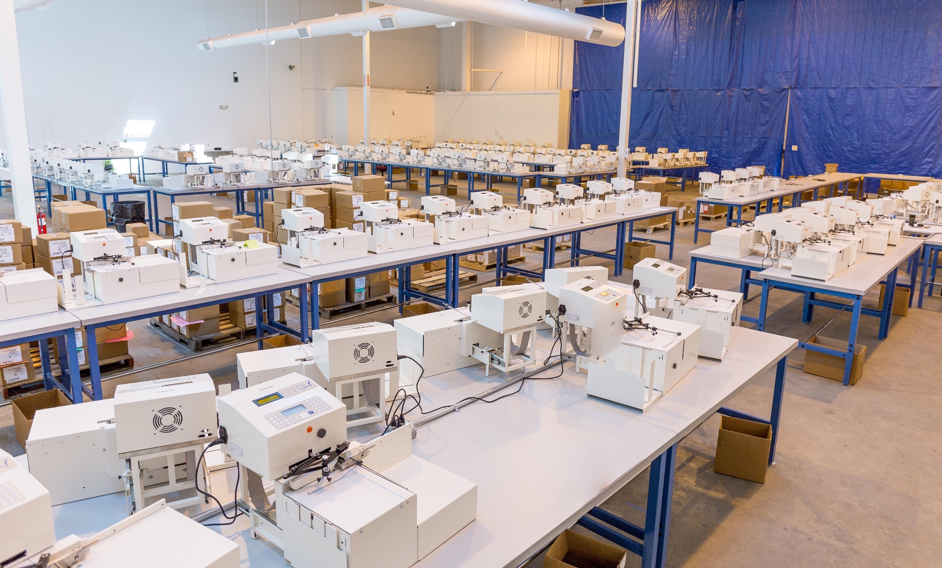 Rows of assembled machines ready to ship