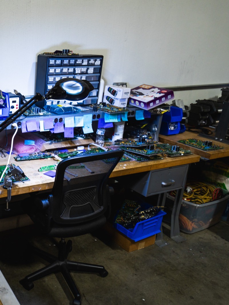 Electronics bench at Pen Point Technologies with UniProd circuit boards being refurbished