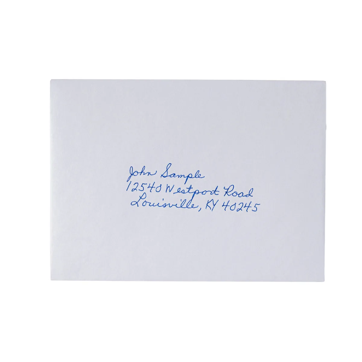 Envelope hand-addressed by the UniProd in blue ballpoint: name, street and city on three lines