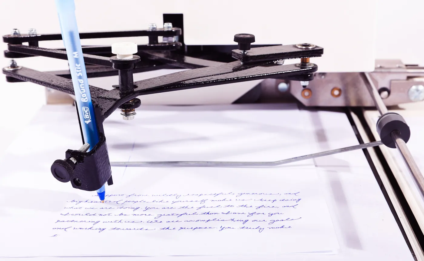 Autopen machine handwriting cursive in blue ink with ballpoint pen