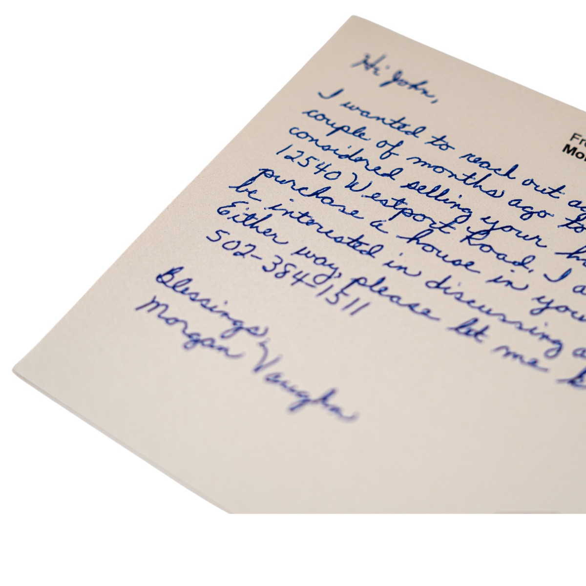 Handwritten envelope addressed in real pen, the kind real estate farm mailings are built on